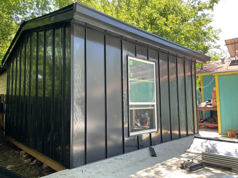 Black standing seam metal wall panels for Roof Inspection in Holtville