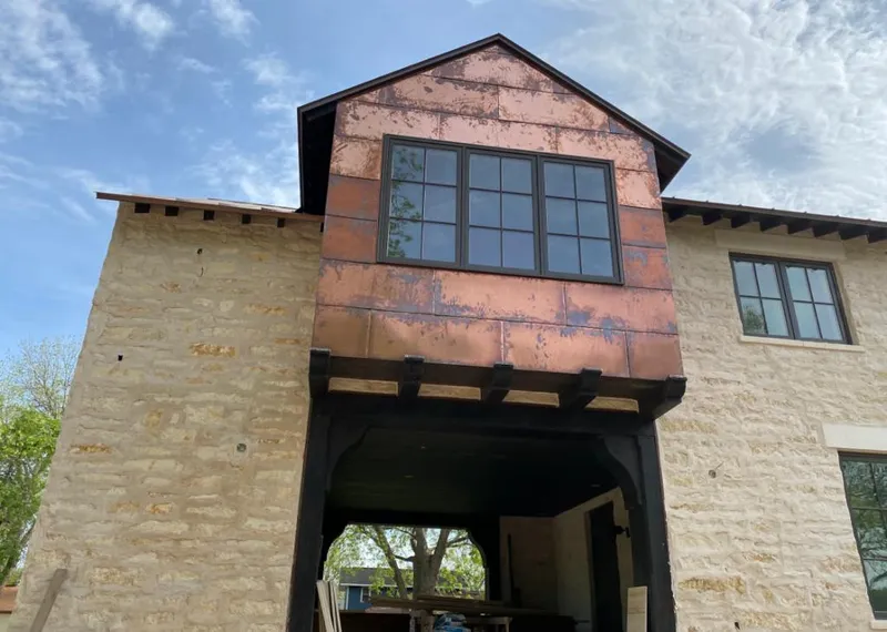 Copper metal panel facade on a stone building for Metal Roof Coating in Holtville
