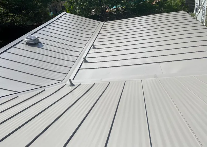 Solar attic fan installed on a metal roof for Roof Ventilation in Holtville